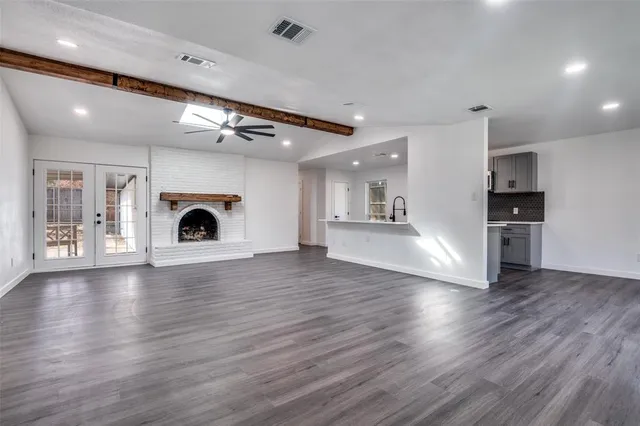 a view of kitchen and sink with wooden floor