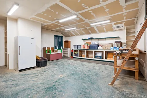 a view of a white house with a patio