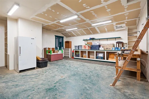 a view of a white house with a patio