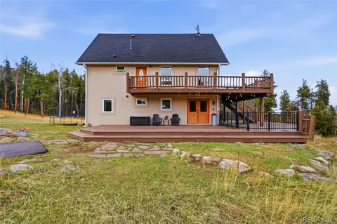 a view of a house with swimming pool yard and patio