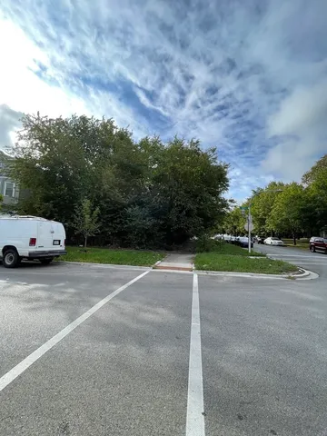 a view of a parked car with city street