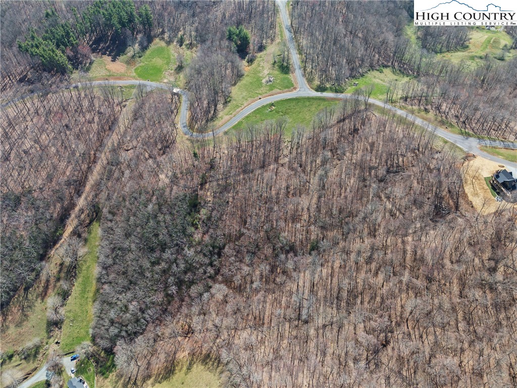 Lot 36 Poplar Forest Drive Boone, NC 28607 - Photo 21 of 21 a aerial view of a house with a yard and large trees all around