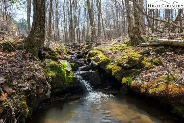 a backyard of a house with a yard and outdoor seating
