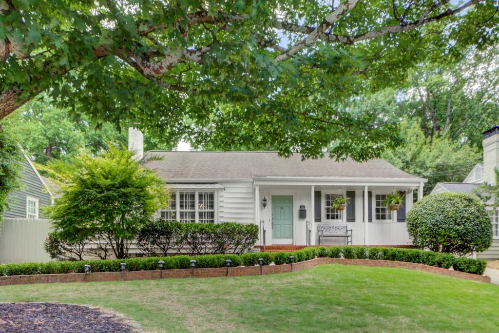 362 Redland Road Northwest Atlanta, GA 30309 - Photo 1 of 1 a front view of a house with a yard