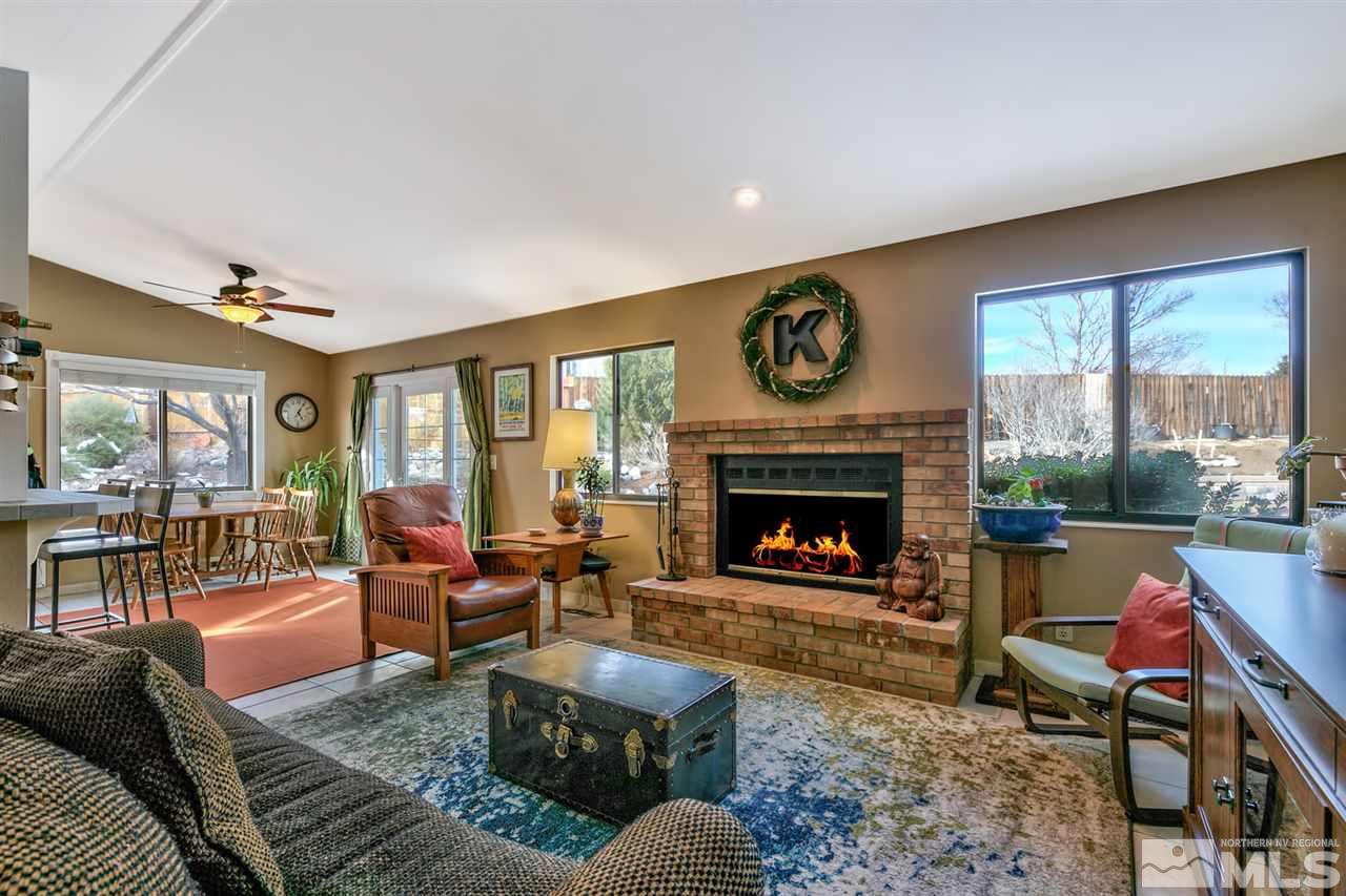 5211 Coit Drive Reno, NV 89523 - Photo 1 of 1 a living room with furniture and a fireplace