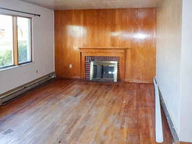 115 Mountain View Drive Armagh, PA 15920 - Photo 11 of 28 a view of empty room with wooden floor and fireplace
