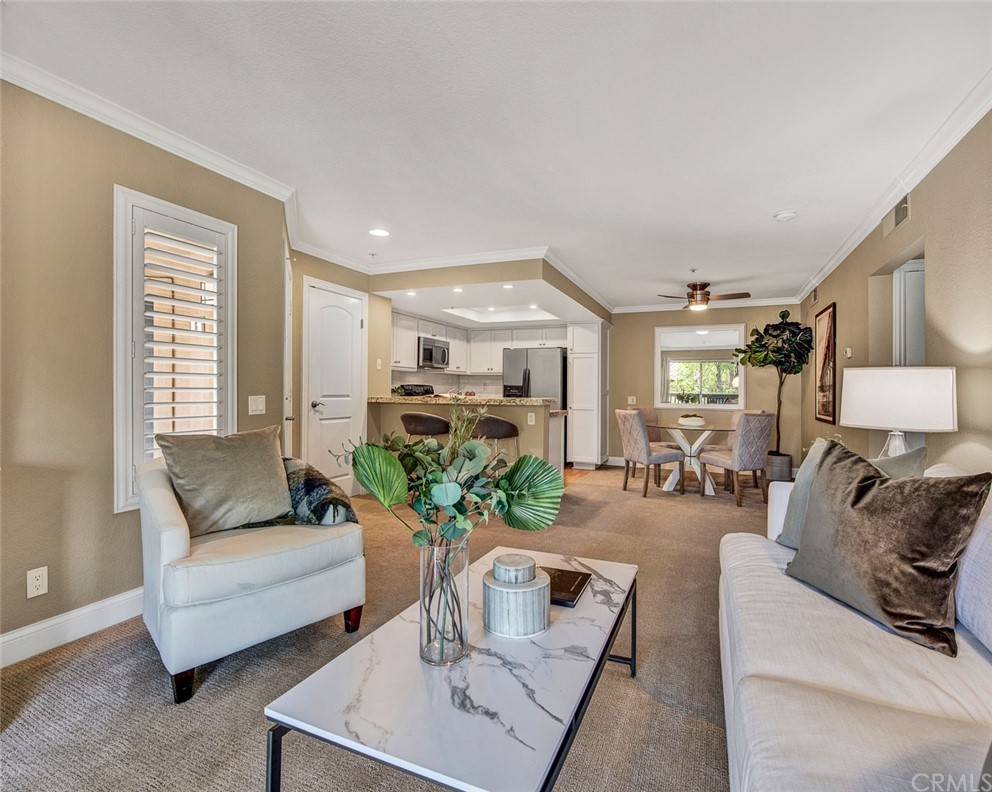 216 South Cross Creek Road, Unit J Orange, CA 92869 - Photo 1 of 1 a living room with furniture and a potted plant