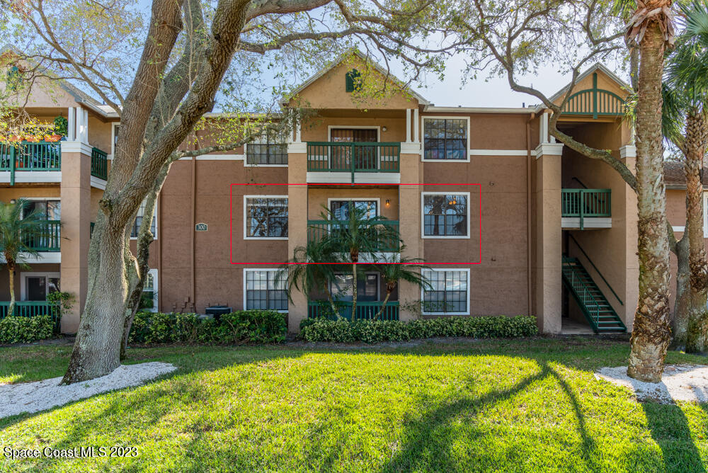 7667 North Wickham Road, Unit 312 Melbourne, FL 32940 - Photo 2 of 47 a front view of house with yard and green space