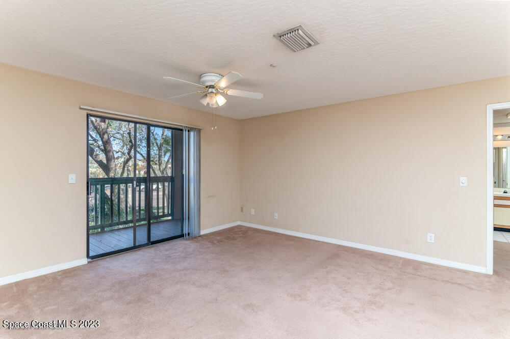 7667 North Wickham Road, Unit 312 Melbourne, FL 32940 - Photo 31 of 47 a view of an empty room with a window