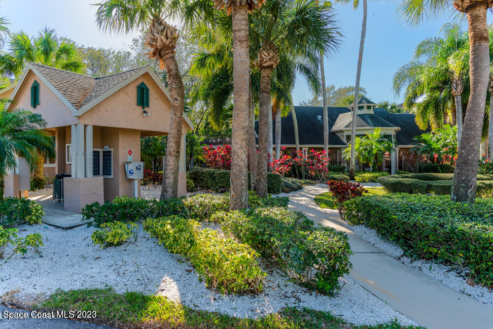7667 North Wickham Road, Unit 312 Melbourne, FL 32940 - Photo 35 of 47 a front view of house with yard and green space