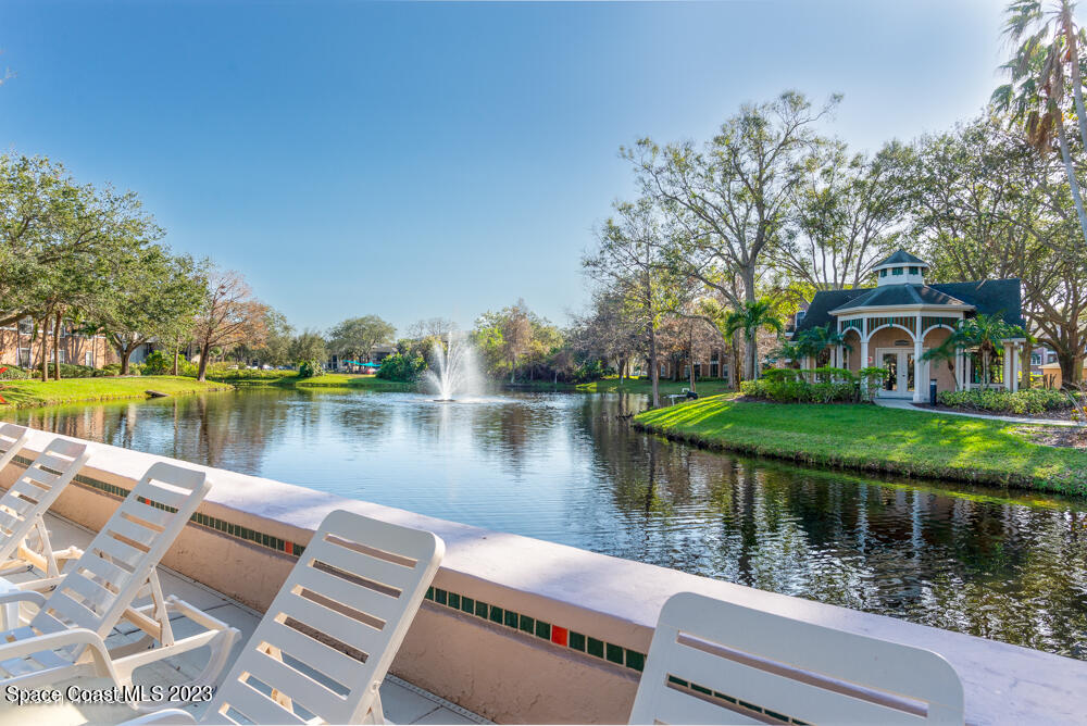 7667 North Wickham Road, Unit 312 Melbourne, FL 32940 - Photo 4 of 47 a view of a lake with a house next to a lake