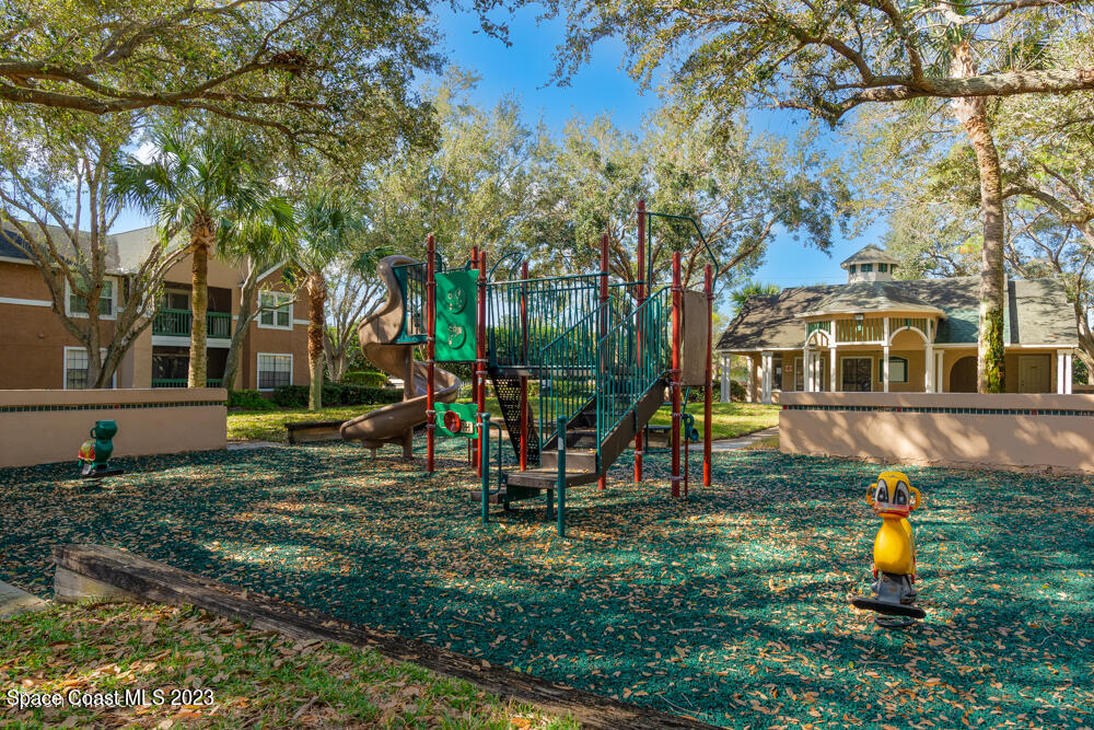 7667 North Wickham Road, Unit 312 Melbourne, FL 32940 - Photo 47 of 47 a view of a house with a backyard