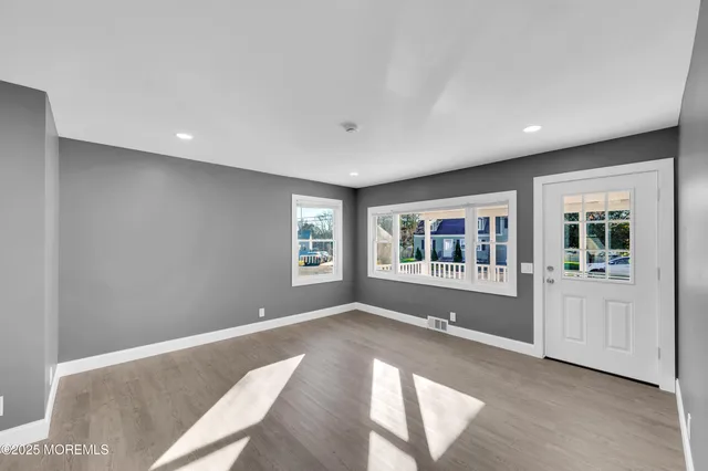 a view of livingroom with furniture window and front door