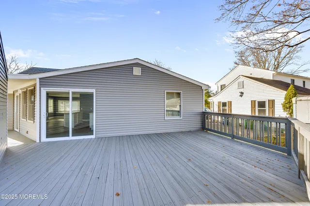 a view of a house with a big yard next to a big yard