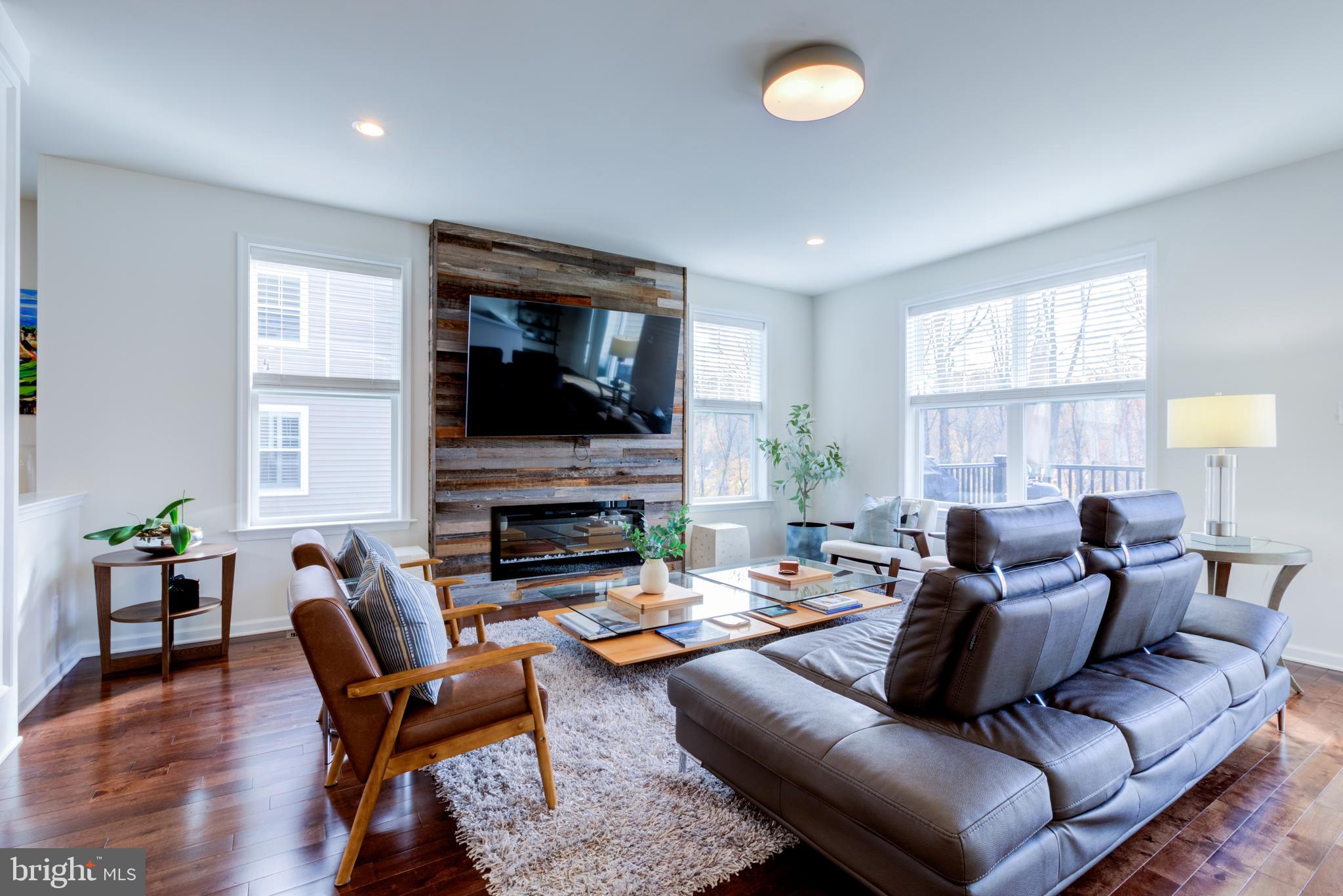 3044 Marias Way Garnet Valley, PA 19060 - Photo 16 of 63 a living room with furniture a fireplace and a flat screen tv