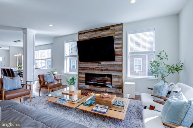 a view of entryway with wooden floor and stairs