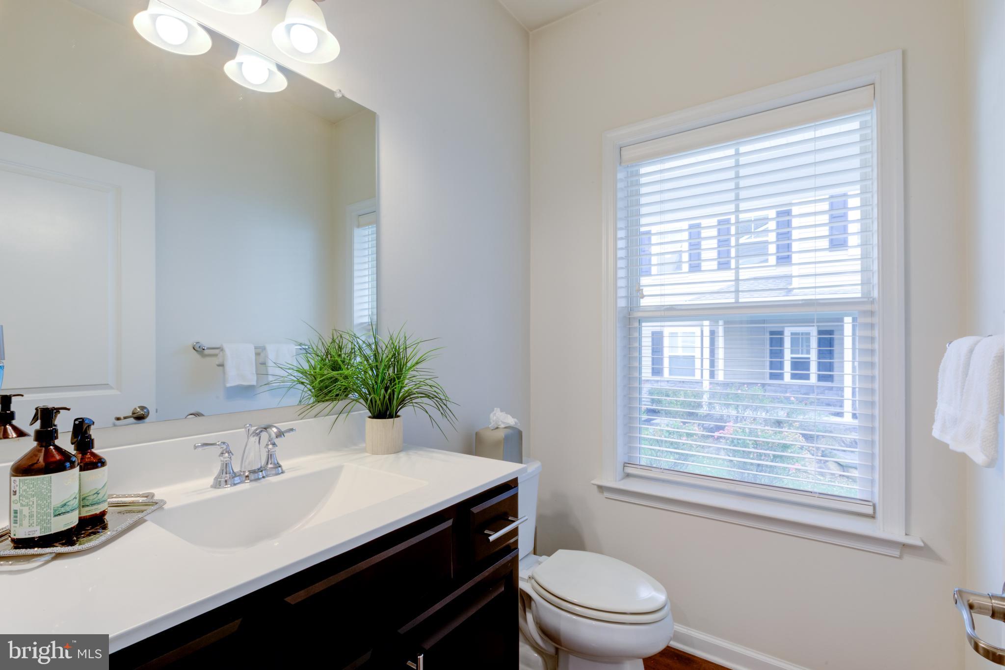 3044 Marias Way Garnet Valley, PA 19060 - Photo 23 of 63 a bathroom with a sink a toilet a mirror and a window
