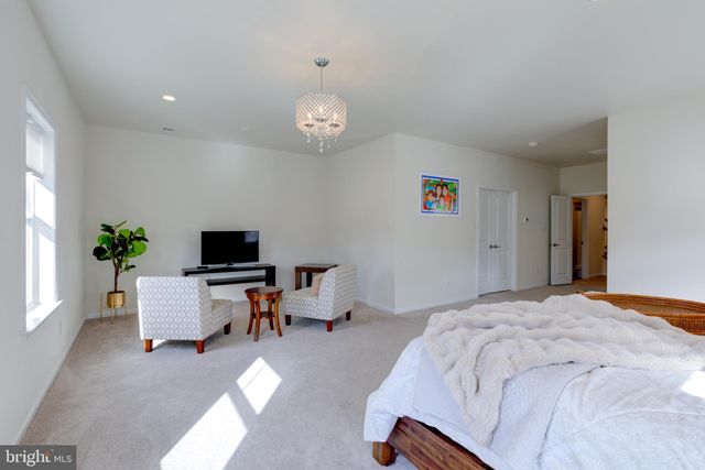 a bedroom with a bed and a table