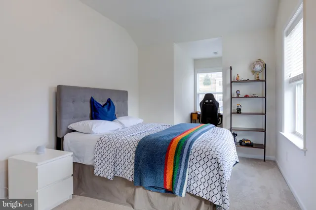 a view of a workspace with furniture and a book room
