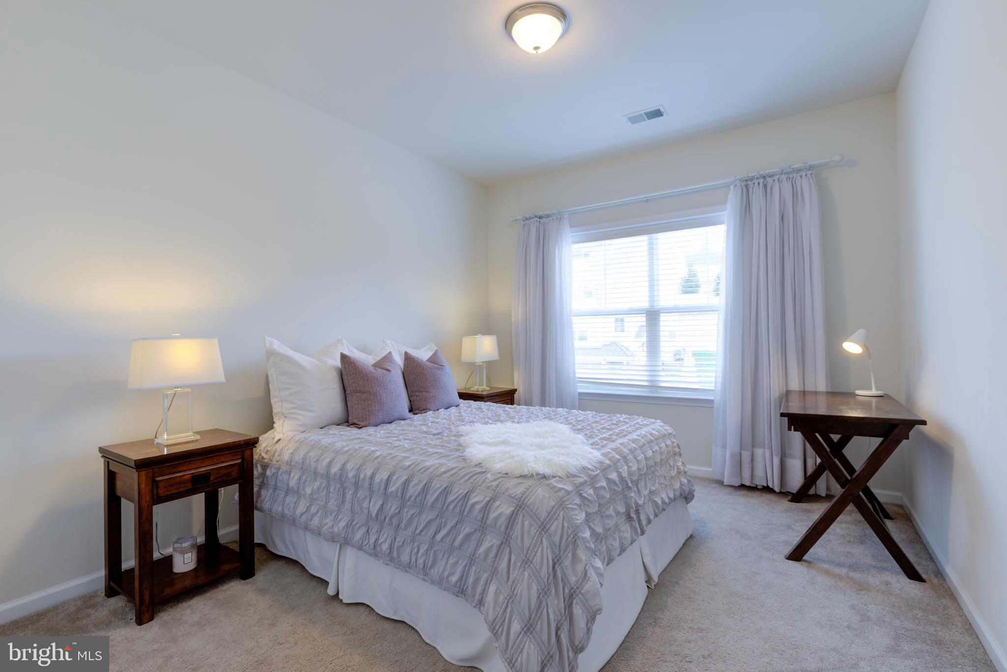 3044 Marias Way Garnet Valley, PA 19060 - Photo 43 of 63 a bedroom with a bed and a table