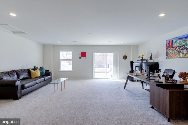 a room with gym equipment and white walls