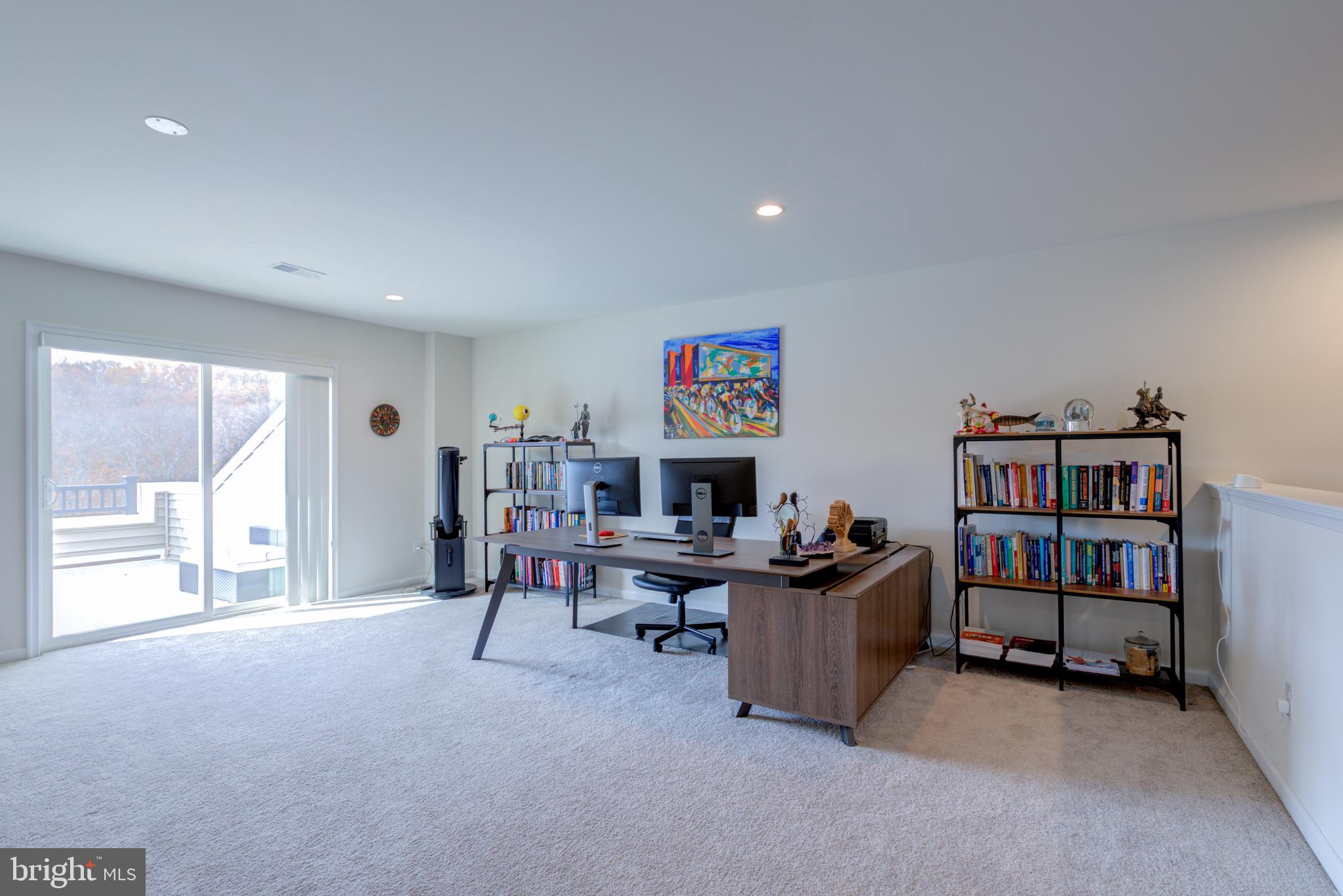 3044 Marias Way Garnet Valley, PA 19060 - Photo 48 of 63 a living room with furniture and a book shelf