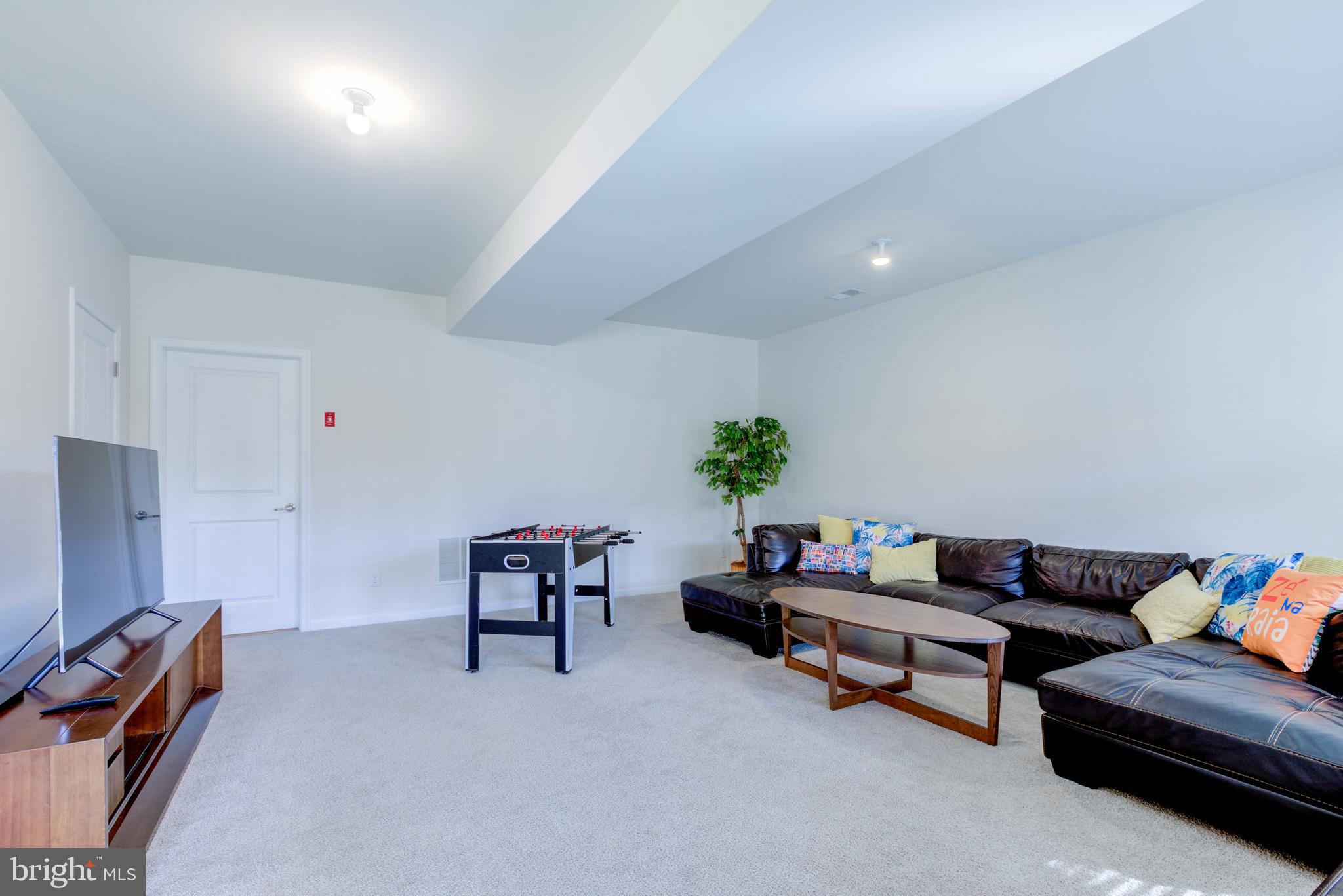 3044 Marias Way Garnet Valley, PA 19060 - Photo 58 of 63 a living room with furniture and a couch