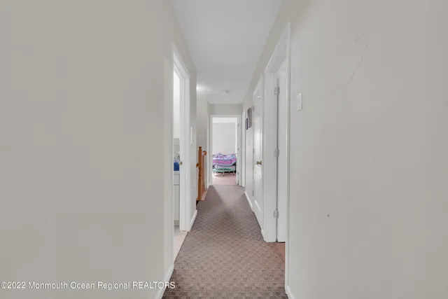 a spacious bathroom with a double vanity sink a mirror and a shower