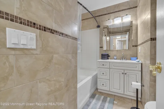 a kitchen with a stove sink and refrigerator