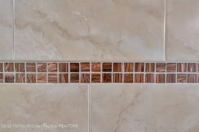 a kitchen with a stove window and cabinets