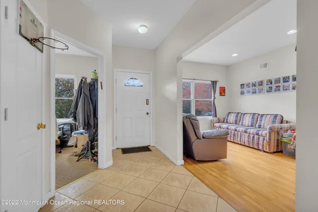 a bedroom with furniture and a book shelf