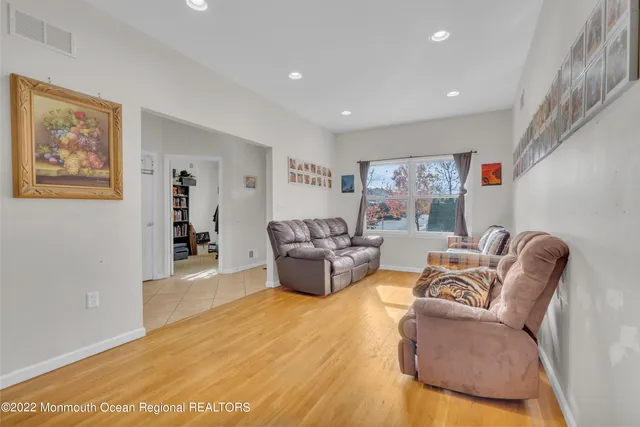 a living room with furniture and a rug