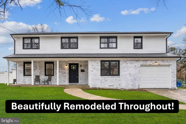 a view front of houses with a yard