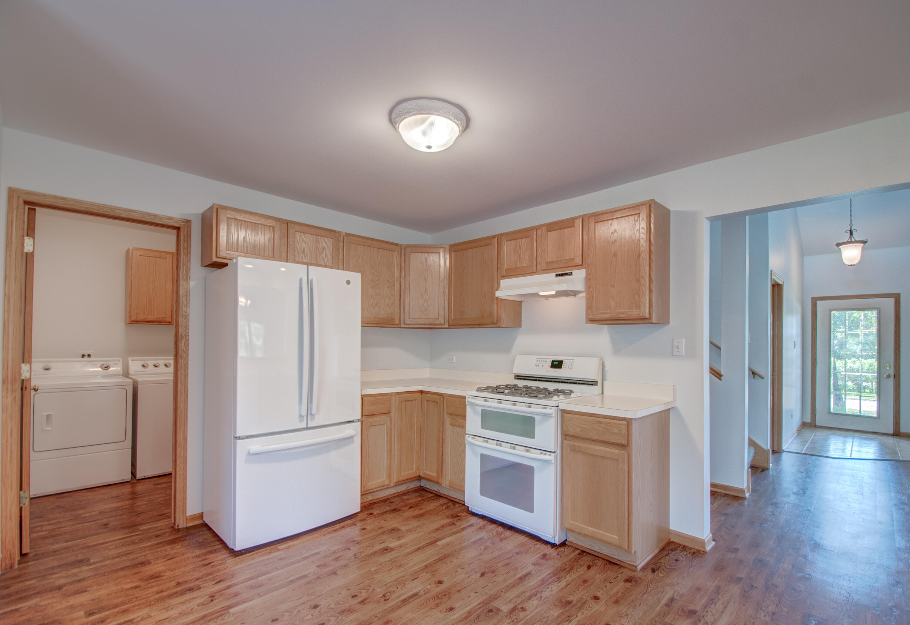 93 West Richton Road Crete, IL 60417 - Photo 11 of 51 a kitchen with a refrigerator a stove top oven a sink and cabinets
