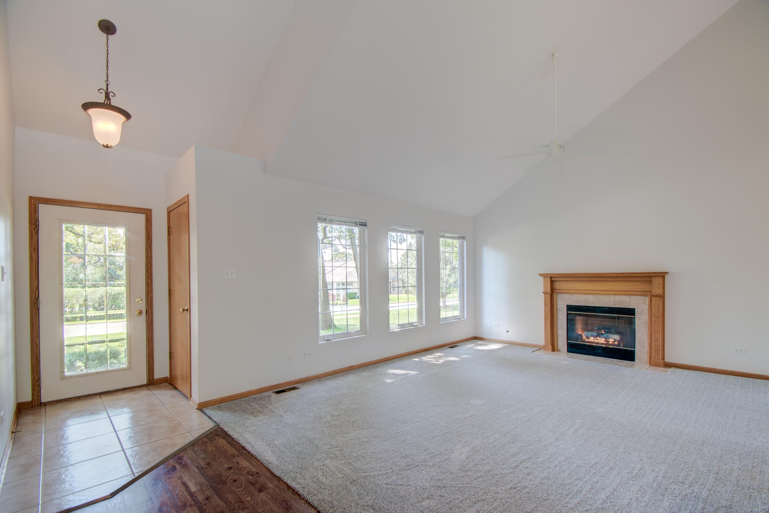 93 West Richton Road Crete, IL 60417 - Photo 4 of 51 a view of a livingroom with a fireplace and window