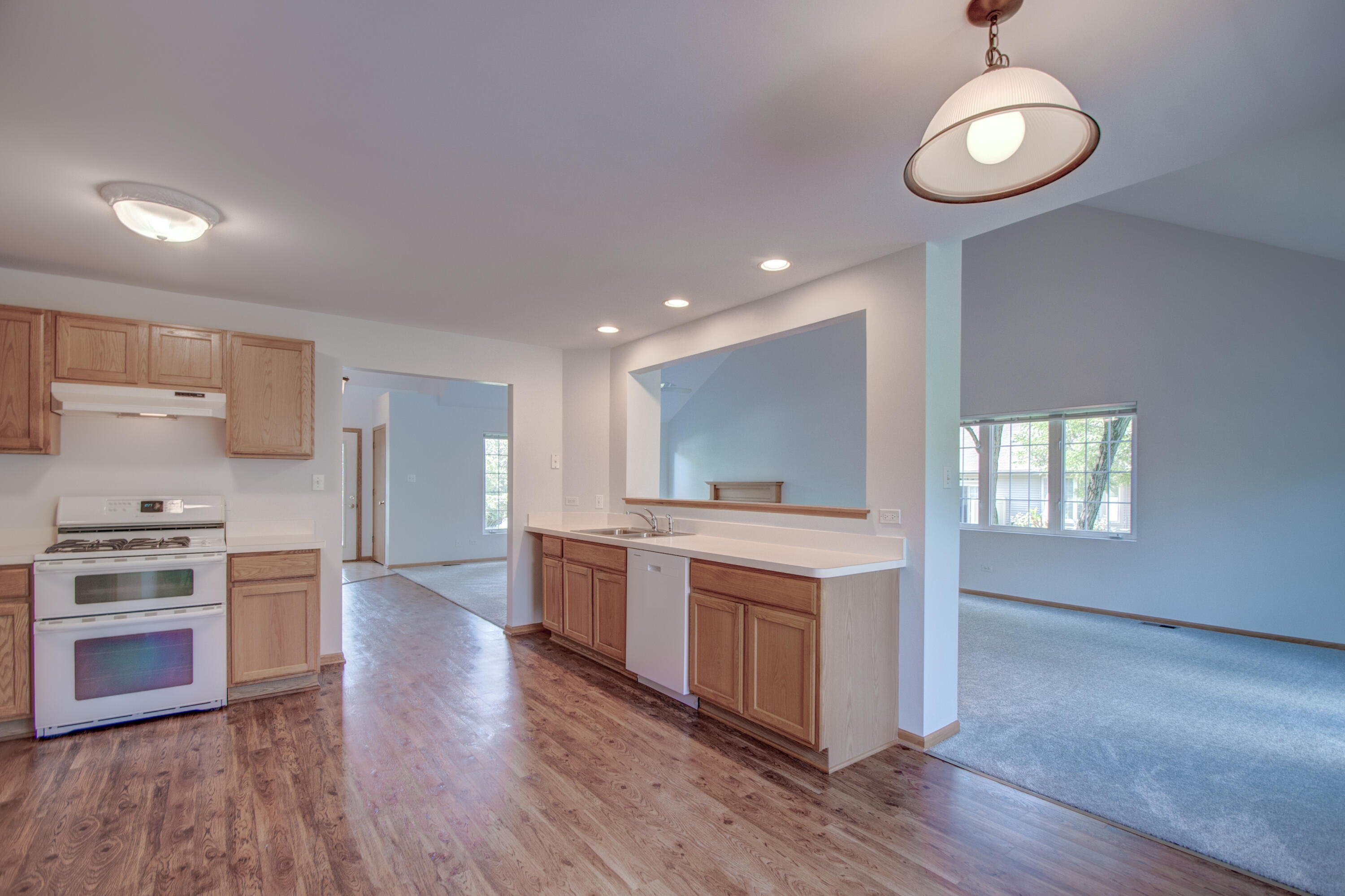 93 West Richton Road Crete, IL 60417 - Photo 9 of 51 a kitchen with stainless steel appliances granite countertop a stove and a sink