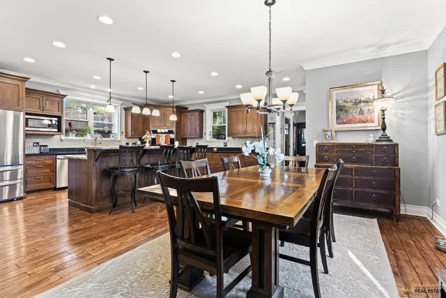 a view of a dining area with furniture window and wooden floor
