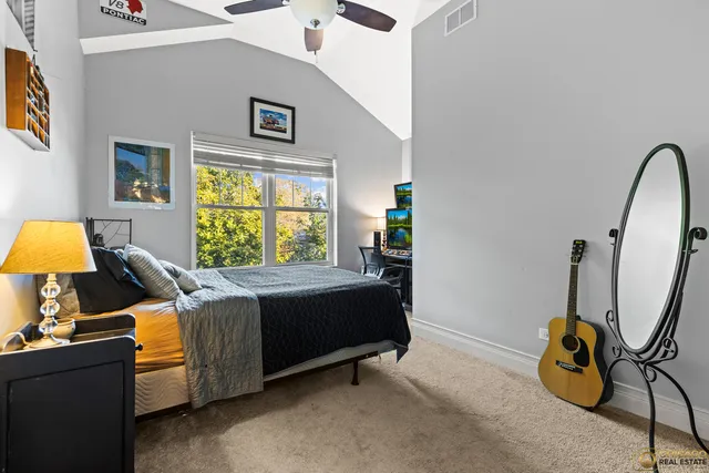 a bed room with a bed and a window