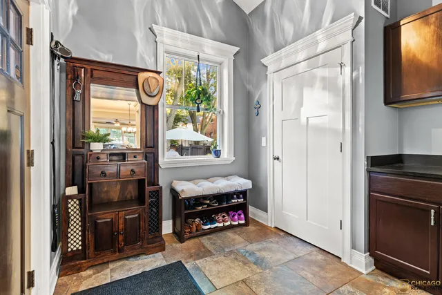 a view of kitchen with refrigerator and window