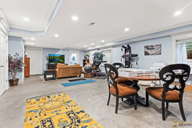 a living room with furniture and a rug