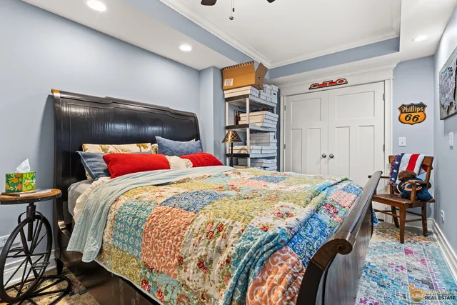 a bedroom with a bed and a desk