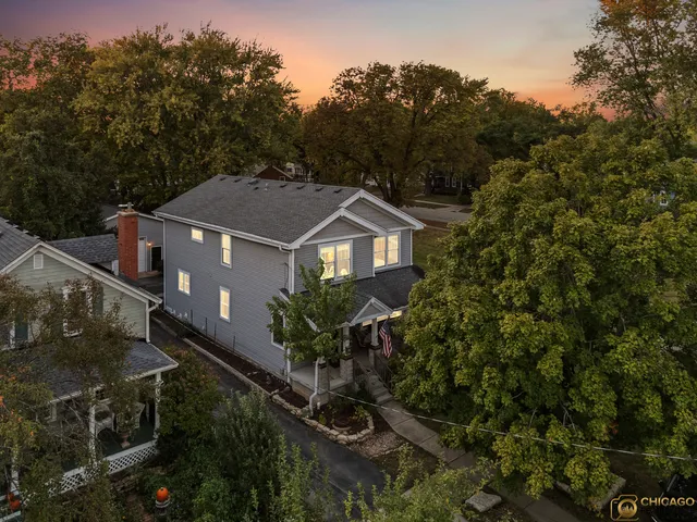 a house with trees in the background