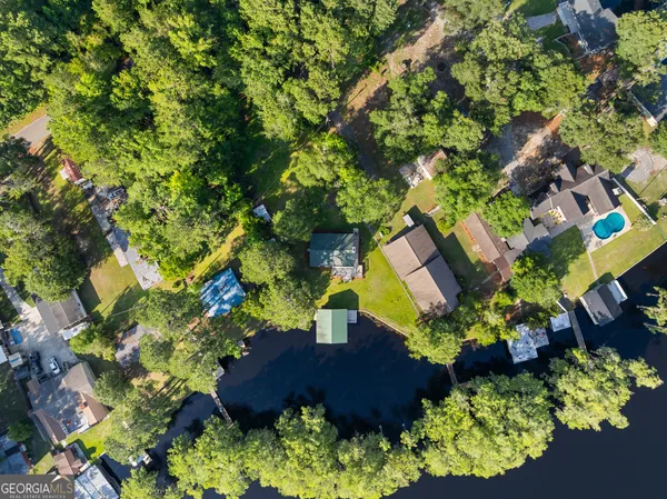 an aerial view of house with lake lake view and mountain view