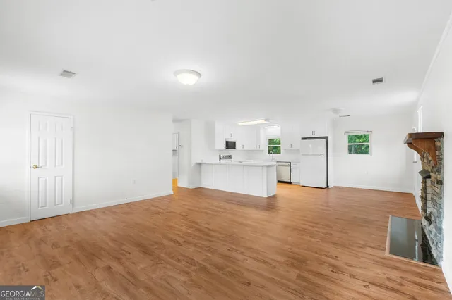 a view of a kitchen with microwave and cabinets