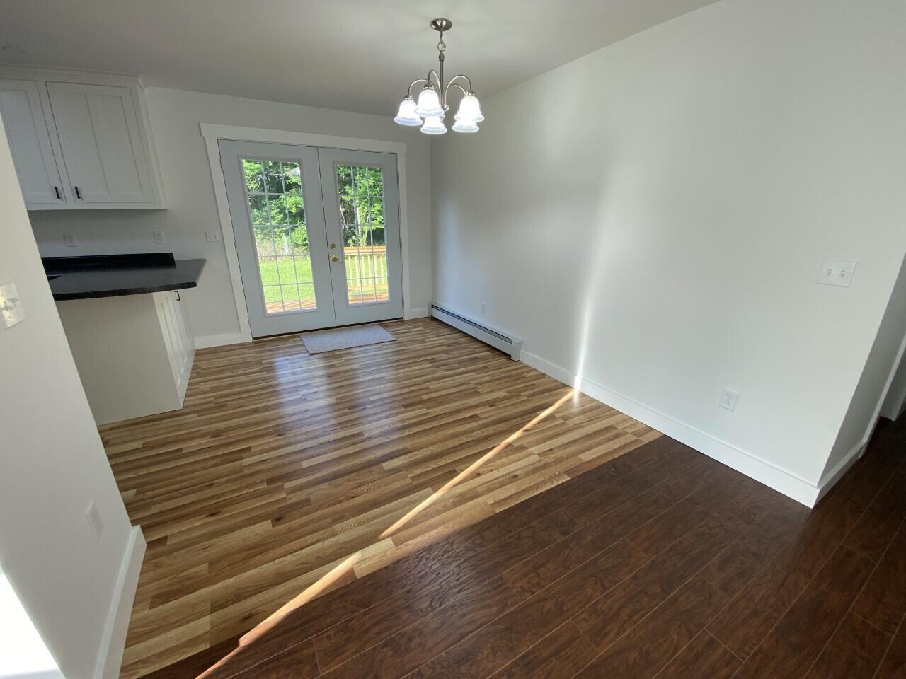 9 Chestnut Street Unity, ME 04988 - Photo 10 of 34 10-Living room to kitchen and dining are