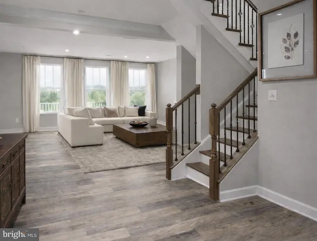 a kitchen with a sink a stove a refrigerator and white cabinets