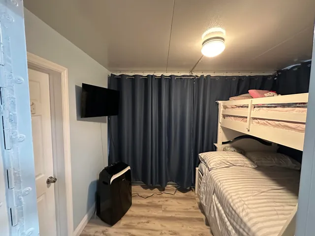 a room with a bed and furniture