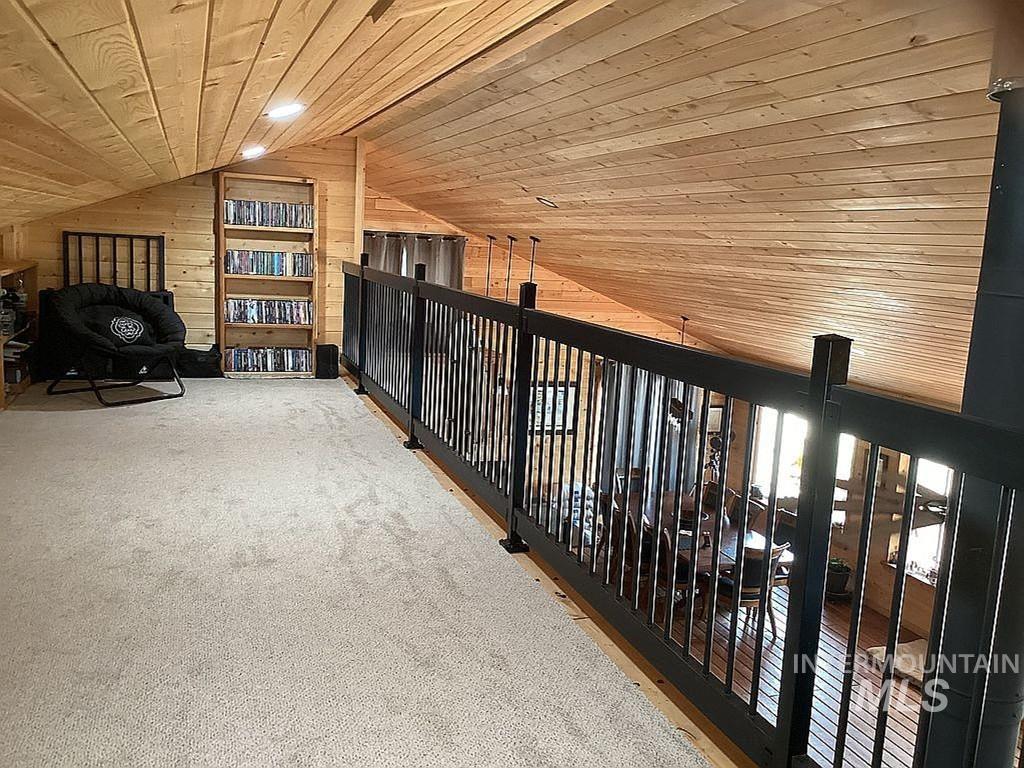 1000 Pardee Road Kamiah, ID 83536 - Photo 17 of 50 Loft space featuring wood-finish ceiling and walls, recessed lighting, and light-toned carpeting