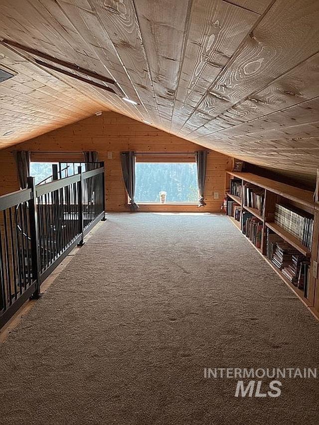 1000 Pardee Road Kamiah, ID 83536 - Photo 18 of 50 Carpeted loft space featuring an angled wood-paneled ceiling, two picture windows, and built-in shelving