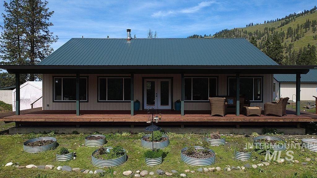 1000 Pardee Road Kamiah, ID 83536 - Photo 2 of 50 Front exterior featuring a covered porch with natural wood decking and a durable metal roof